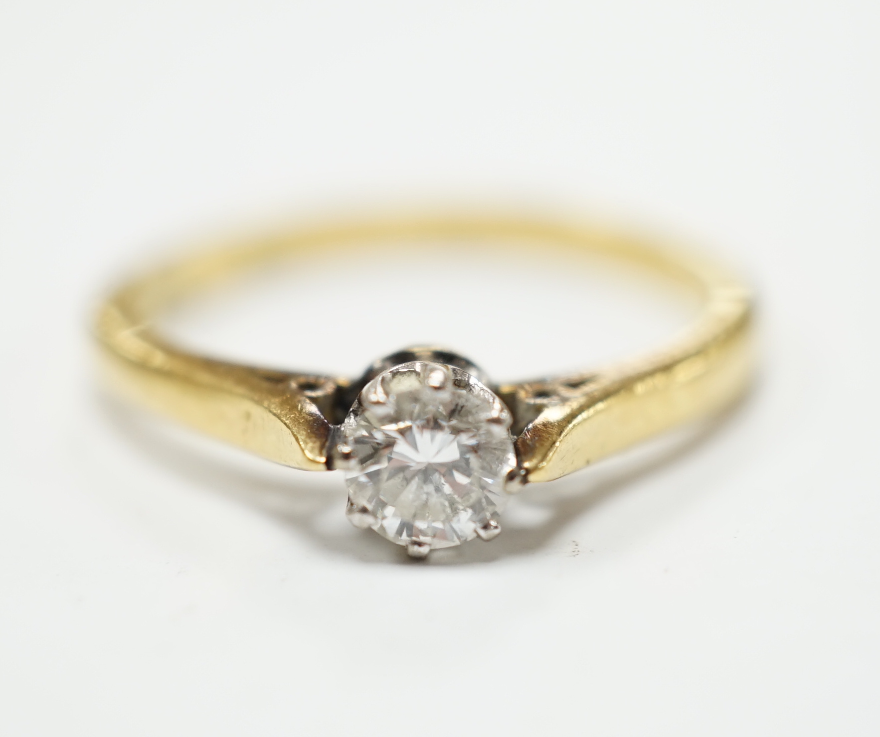 An 18ct, plat and solitaire diamond ring, size O, gross weight 3.1 grams.